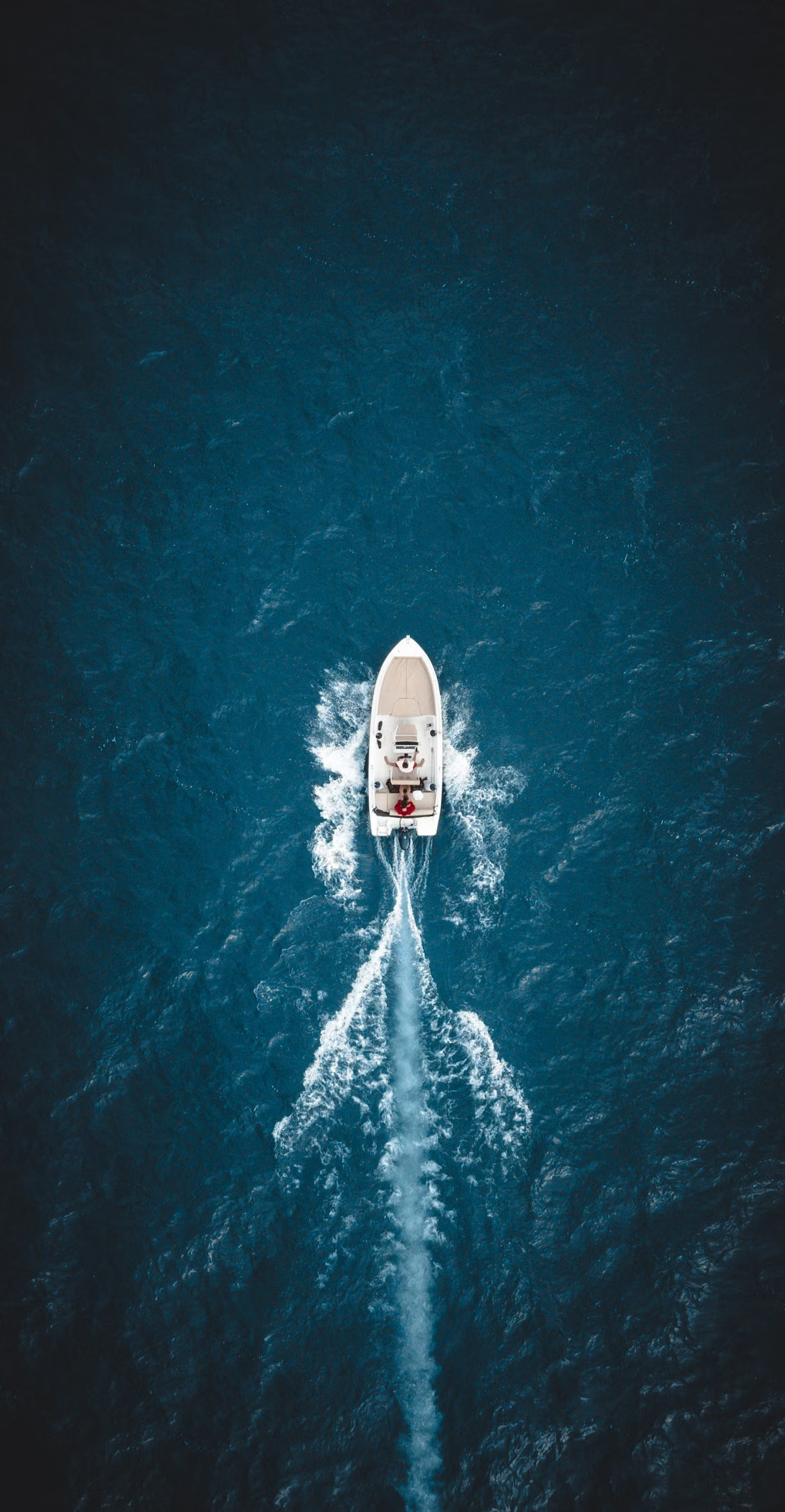 Catamaran sailing on turquoise Caribbean water off a Cuban beach